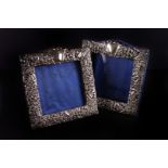 A pair of Edward VII silver mounted photograph frames, the square framed with ornate scrolling