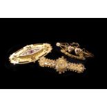 A group of five gold and yellow metal brooches,  including a Victorian 15ct and a 9ct example, a