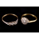 Two diamond set rings,  including an illusion cluster, finger size M, and a three stone, finger size