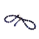 A lapis bead necklace, the uniform beads supporting an obelisk pendant, drop earrings en suite (3)