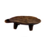 A 19th century Southern African wooden bowl,  on four feet, with a handle for carrying or hanging,