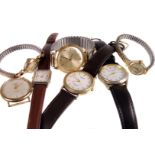 An assortment of gents and ladies wristwatches, including a 9ct gold Baume gents presentation watch,