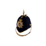 A British Home Service Officer's full dress helmet, having cap badge with crown and crest with motto