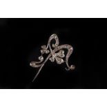 An Belle Époque diamond part brooch,  the open work scrolling mount set overall with old cuts, the