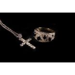 A diamond cross pendant,  set overall with brilliants, to a chain fine link chain marked as