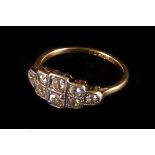 An Art Deco diamond ring,  the  two rows of graduated old cuts pave set in a geometric platinum