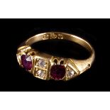 A late Victorian ruby and diamond six stone ring,  the two principle oval cut rubies flanked with