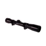 A modern Bushnell Sharpshooter scope, missing dials to side and top