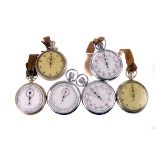 A group of six white metal open faced stopwatches, all marked with the broad arrow, 1940s - 1970s (