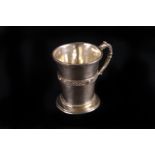 A George V Irish small silver tankard by West & Son,  Dublin 1932, with Celtic strapwork band and