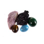 A collection of polished mineral eggs,  various, including malachite, amethyst, rose quartz, tiger's