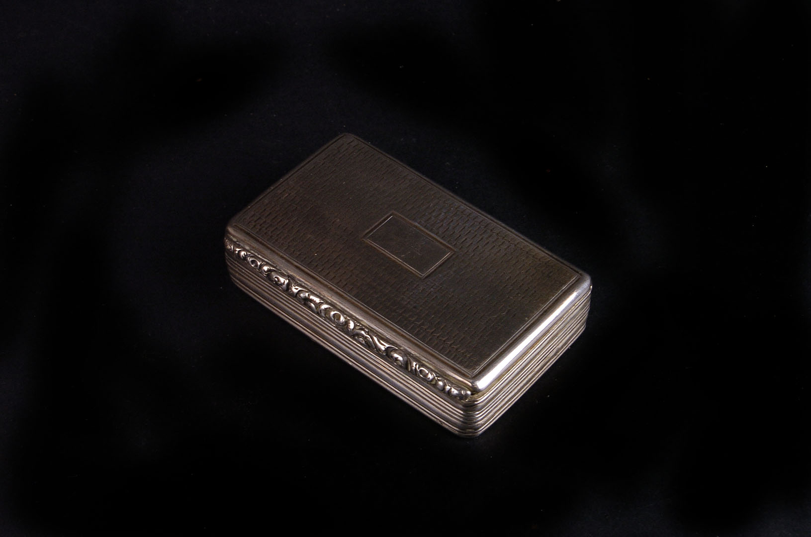 A George IV silver snuff box by Edward Smith, Birmingham 1829, engine turned overall, engraved