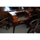 A 20th century mahogany Carlton House style desk, on four tapered supports, with three drawers to