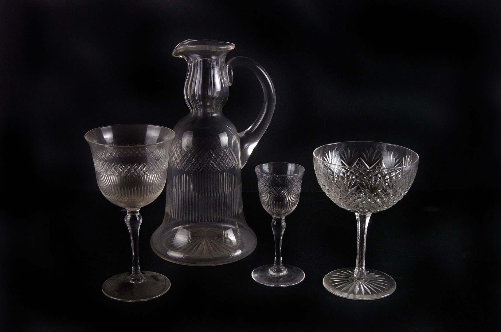 A suite of early 20th century wine glasses,  with finely cut design, together with two matching