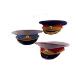 Three Russian military visor caps, possibly comprising Marshall Field, Air Force Officer and
