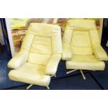 A pair of retro 1950s/1960s Scandinavian leather swivel armchairs, in white leather on five spoke