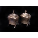 A pair of 19th century silver plated tea canisters,  of shaped baluster form, with pine cone