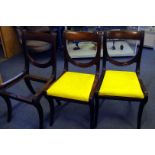 A set of three reproduction mahogany dining chairs, one seat missing, with curved top rail on