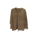A 1950s/60s British Army hooded smock, having four pockets to front and tie string to bottom,