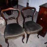 A set of six Victorian mahogany balloon back dining chairs, with green velour stuff-over seats and