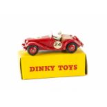 A Dinky Toys 108 MG Midget Sports Car, red body and hubs, tan interior, RN24, in original early