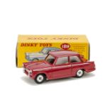 A Rare Dinky Toys Promotional 189 Triumph Herald, in Signal red with spun hubs and no interior, in