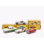 A Dinky Toys 108 MG Midget Sports Car, white body, red hubs, RN28, 105 Triumph TR2 Sports, grey