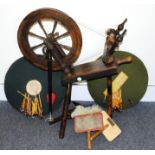 A 1970s wool spinning wheel by Haldane, together with two wool paddles and two lace makers