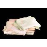 A collection of table lace and linen, including table cloths, napkins, place mats and runners