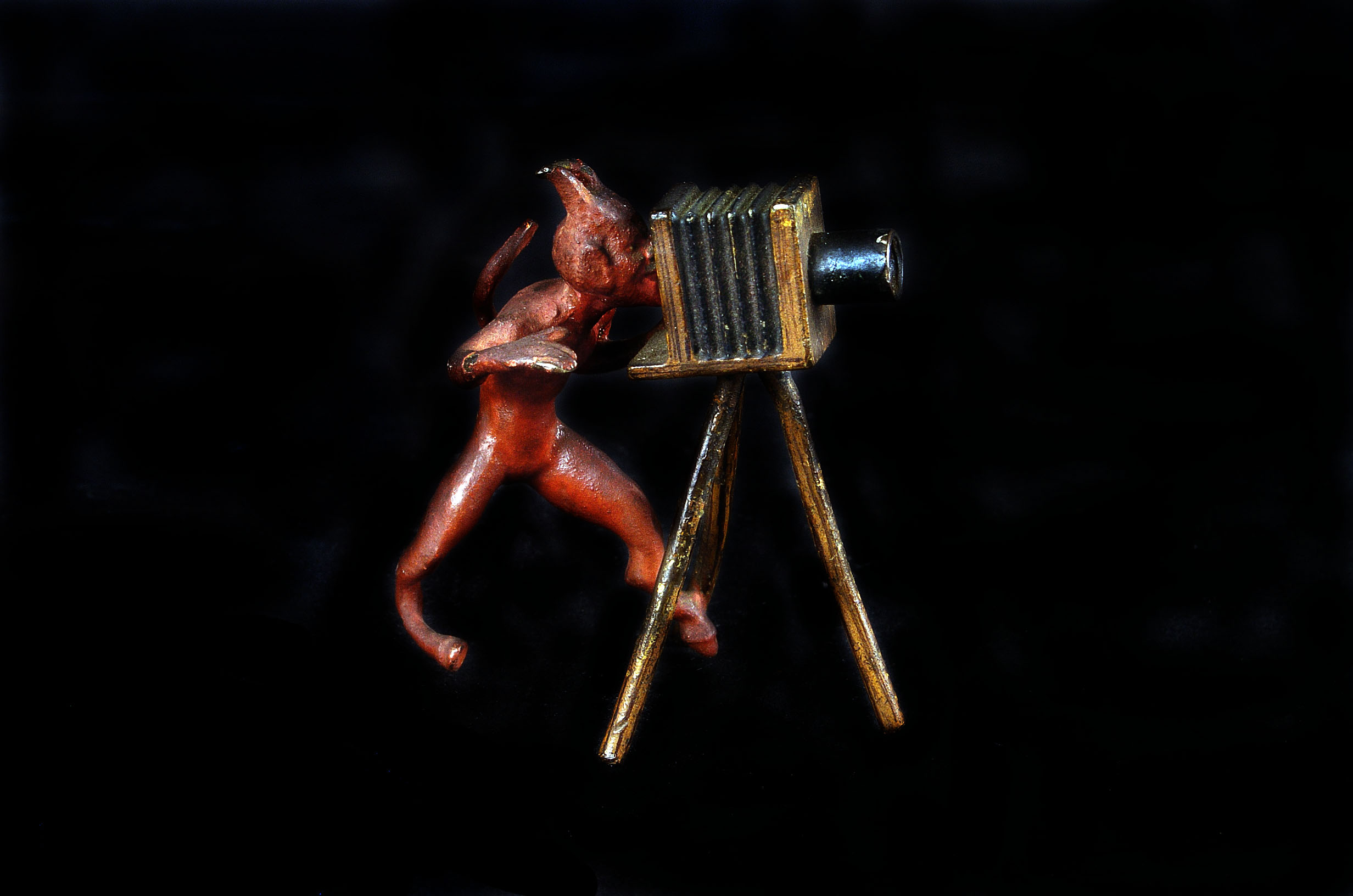 Camera Devil A cold painted bronze of a devil, modelled with a tripod camera, 7cm high
