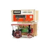 A Mamod TE1a Tablet-fired Live Steam Traction Engine and LW1 Lumber Wagon: in green, ivory and red