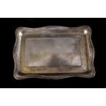 An Art Nouveau George V silver tray by Liberty & Co, rectangular form with shaped rim and having