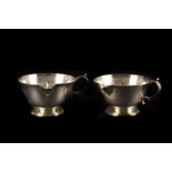 A near pair of silver bleeding bowls, hallmarked Exeter 1733 maker PS, and 1776 by William Pearce,