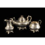 A Victorian silver three piece tea set, Dublin 1853 by John Smith, with chased diaper pattern and