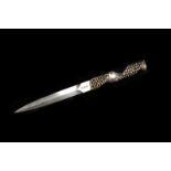 A 1960s silver letter opener by Stuart Devlin, the sharp dagger blade with twist and open work