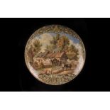 A Staffordshire pot lid, with Anne Hathaway's Cottage in oak leaf and scroll border, cracked and