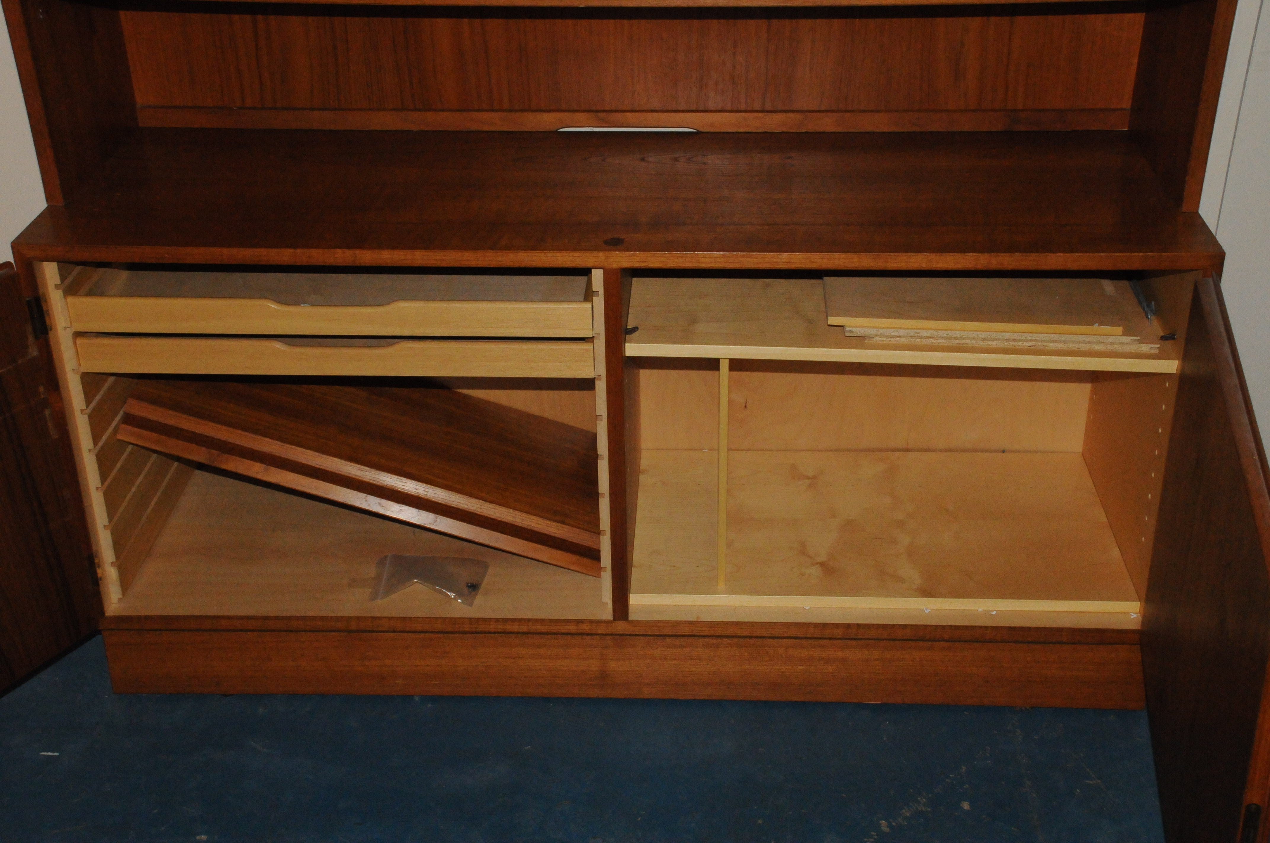 A 1970s Danish teak bookcase cabinet, the upper section with adjustable shelves, the lower with - Image 2 of 2