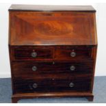 A 19th century mahogany and inlaid bureau, with hinged flap to reveal fitted interior, above two and