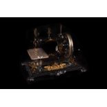 An Art Nouveau period German small sewing machine, in black with floral gilt decoration