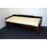 A Chinese Qing dynasty Luohan bed, or opium bed, from the Shangxi province of China, carved from elm