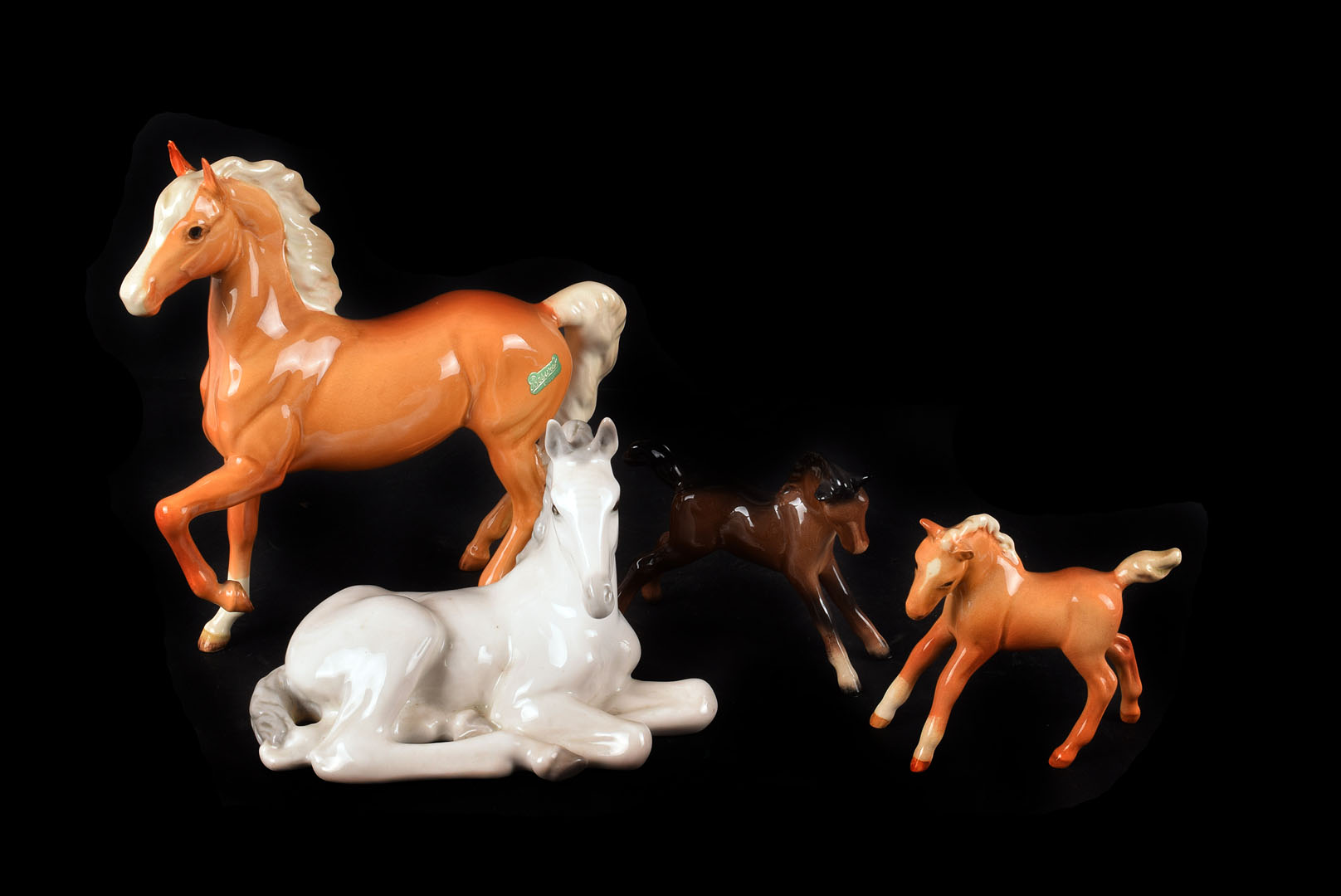 A Collection of Ceramic Horses, mostly Beswick, including foals and a beagle dog, some damage to