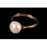 A modern cultured pearl ring, the single pearl 9mm diameter, to a 9ct gold shank finger size N/O