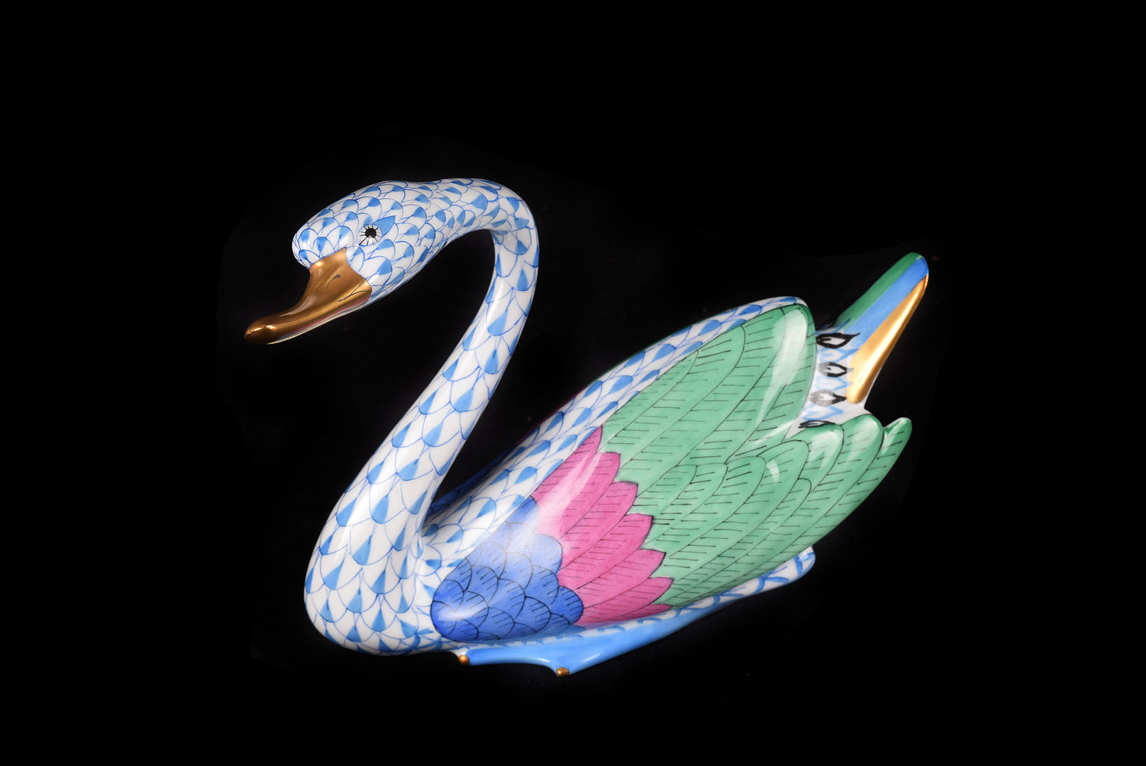A Herend Porcelain Swan, with blue, pink and green wing decoration against an pale blue scale