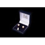 A pair of gold mounted cultured pearl ear studs, the pearls 7mm diameter
