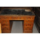 A Victorian oak pedastal desk, lacking front casters, leather top damaged, AF