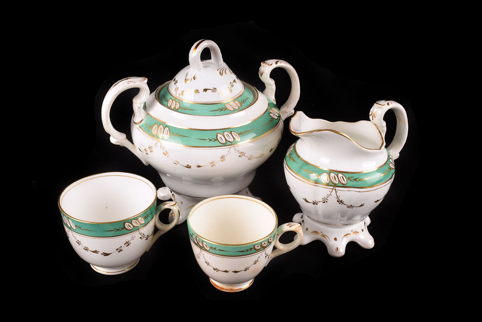 A Edwardian part tea service, of green borders with gilt swag decoration, consisting of 4 serving