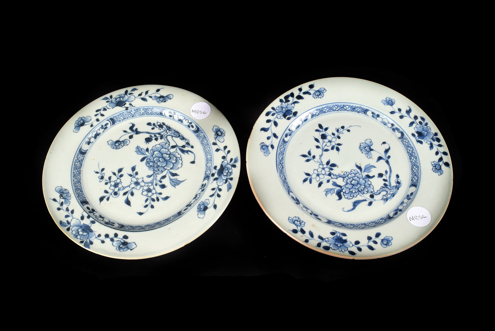 A pair of Chinese export porcelain Nanking cargo plates, with blue floral pattern on pale