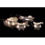 A collection of silver plated items, including three piece tea set, in the Neo Classical taste by