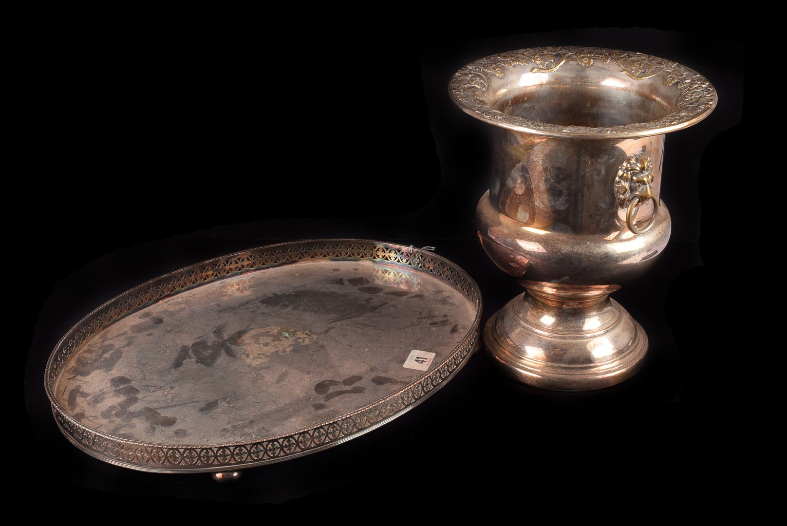 A collection of Victorian and later silver plated items, including a pair of candlesticks, an oval