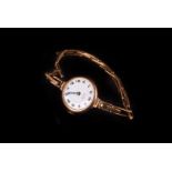 A vintage 9ct gold ladies wristwatch, marked Trojan Junior to white enamel dial with Roman numerals,